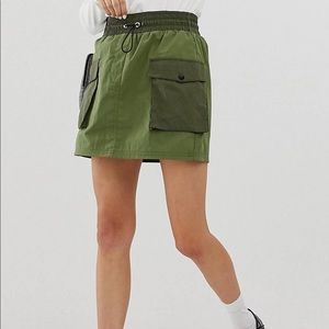 Bershka patched mini skirt in green